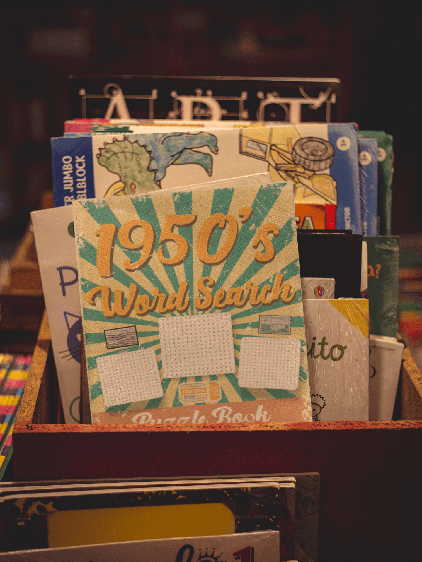 1950's Word Search Puzzle Book displayed in a colorful book bin, showcasing retro design and large print.
