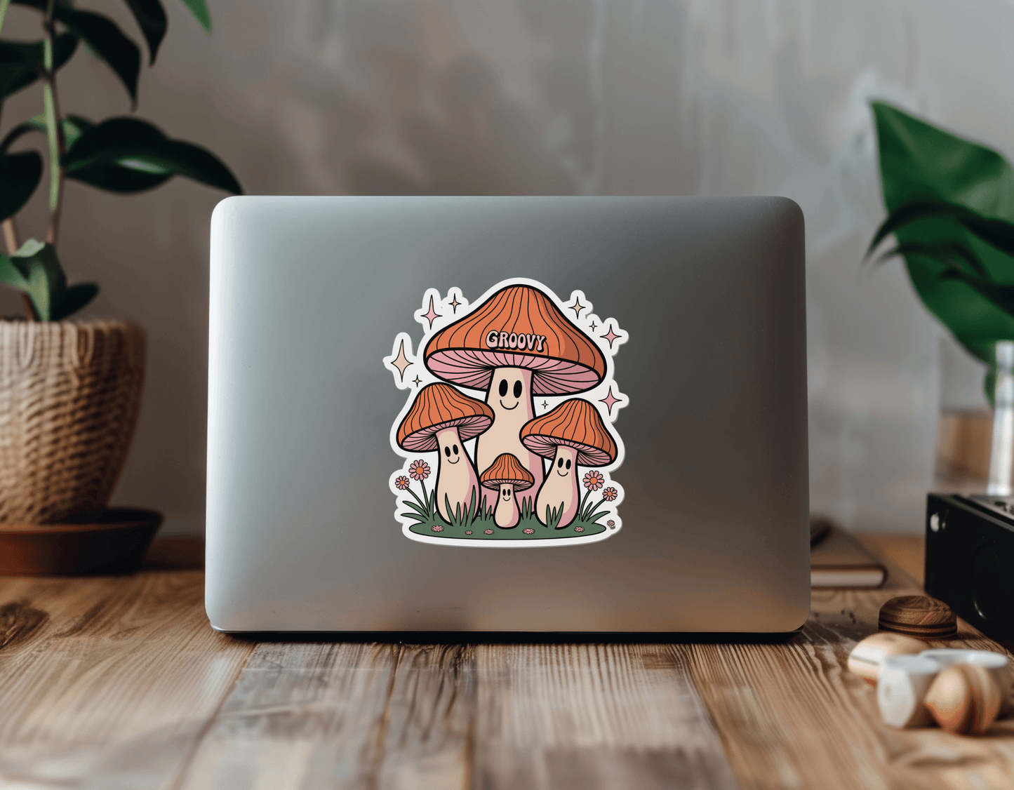 Groovy Mushroom Vibes Sticker on a laptop, featuring colorful mushrooms and decorative elements.