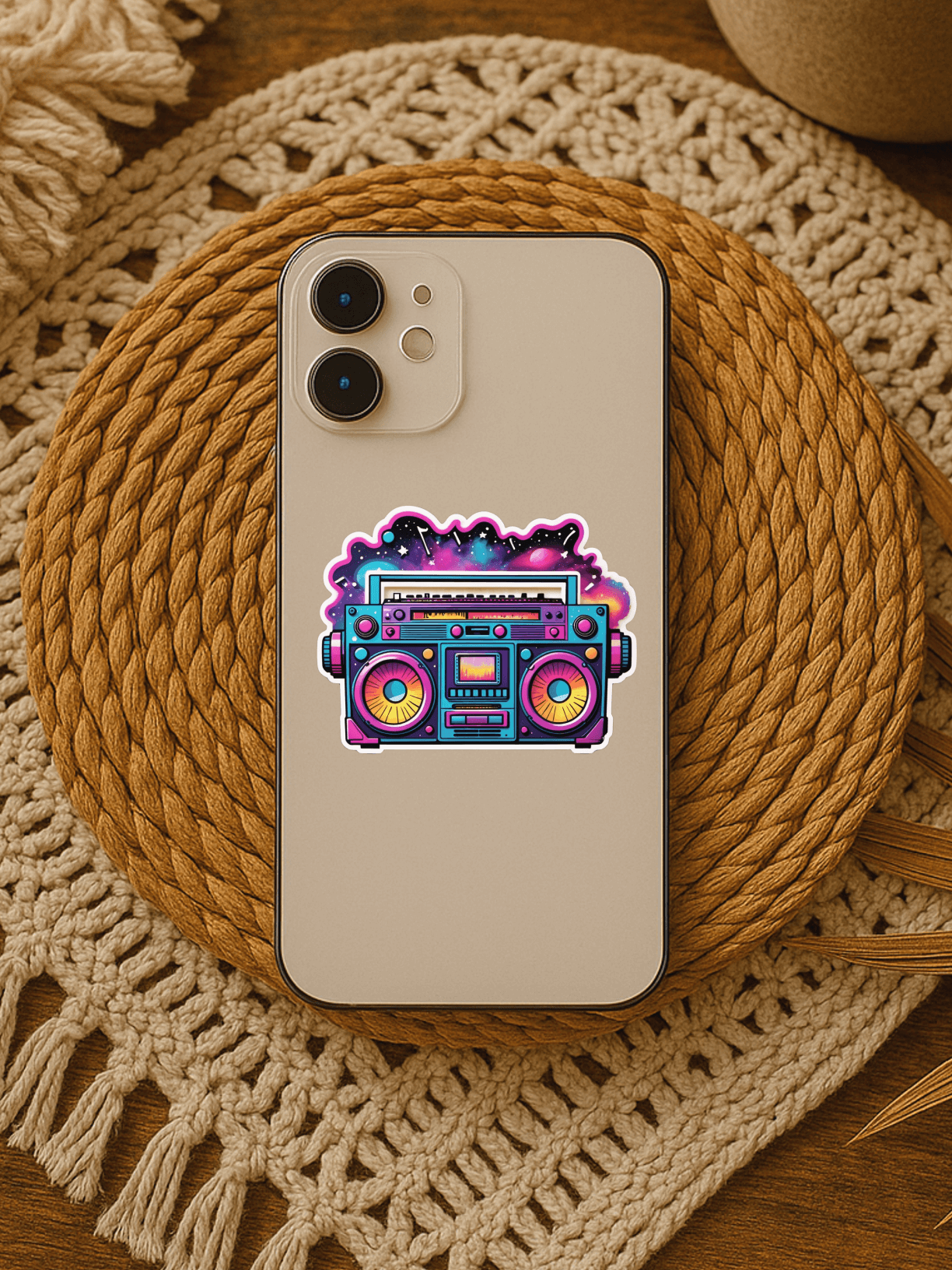 Colorful Galaxy Groove Boombox Sticker on a smartphone, perfect for personalizing devices and adding artistic flair.