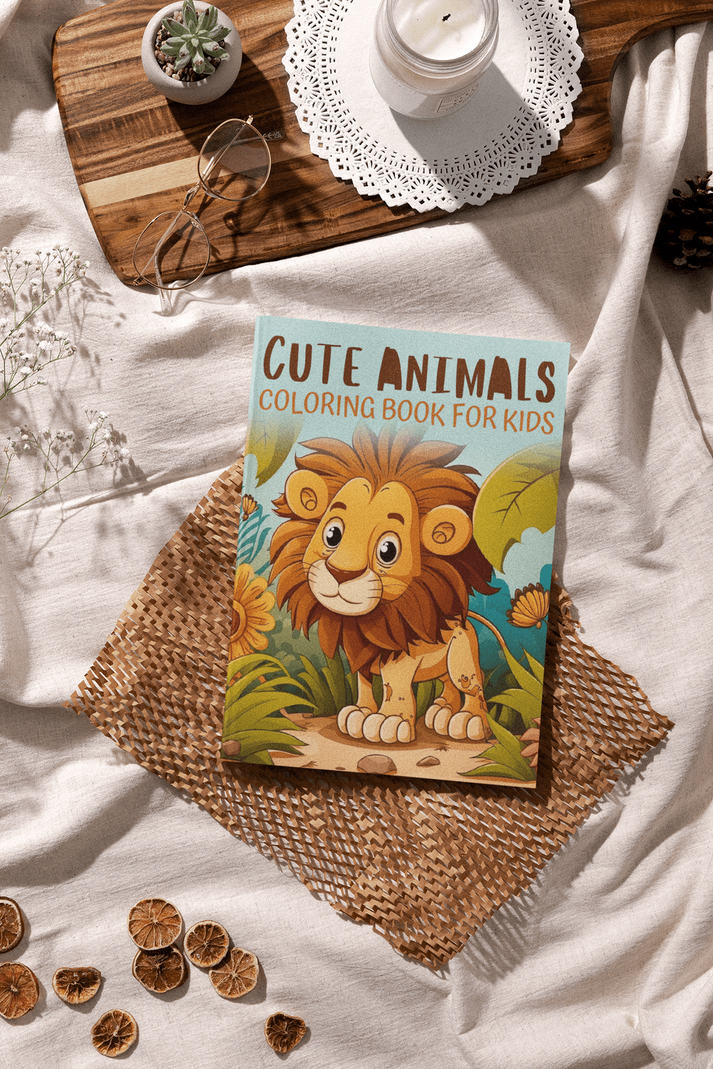 Cute Animals Coloring Book for Kids featuring an adorable lion illustration on a rustic table setting.