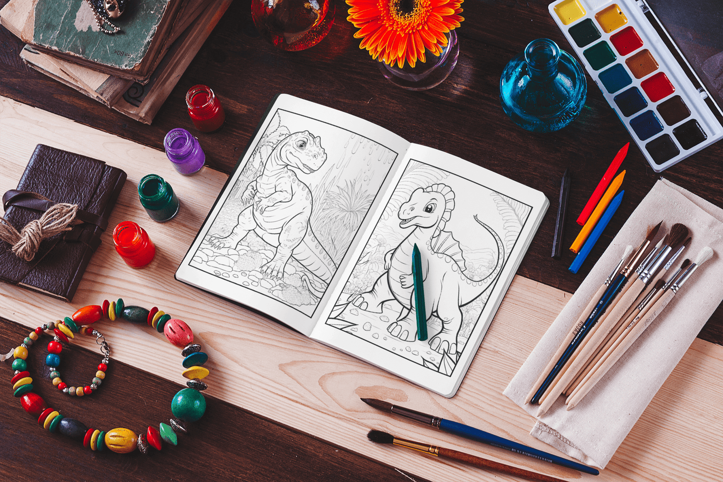 Open Dinosaur Coloring Book on a table with paints, brushes, and accessories, showcasing fun dino designs ready for coloring.