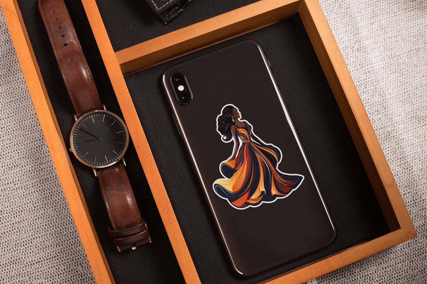 Midnight Elegance Sticker displayed on a phone with a watch and wooden tray, showcasing vibrant design and artistic flair.