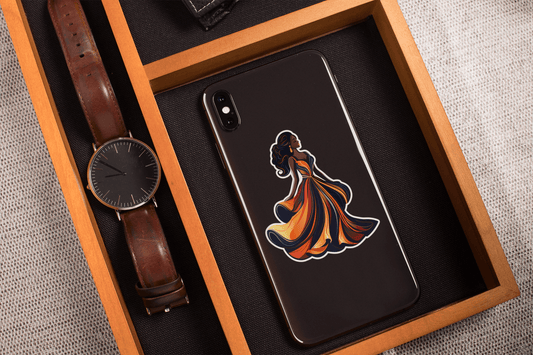 Midnight Elegance Sticker displayed on a phone with a watch and wooden tray, showcasing vibrant design and artistic flair.