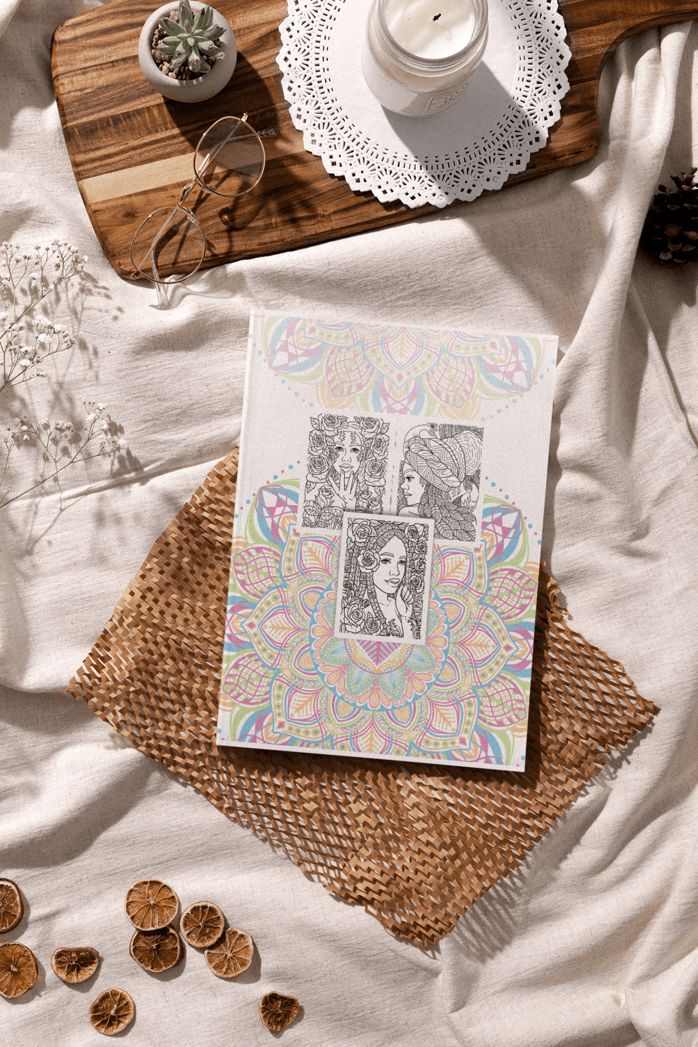 Relaxing Black Women Coloring Book displayed on a cozy table setting with white decor and natural elements.