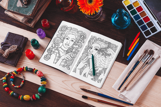 Coloring book pages featuring Black women illustrations on a rustic workspace with art supplies.