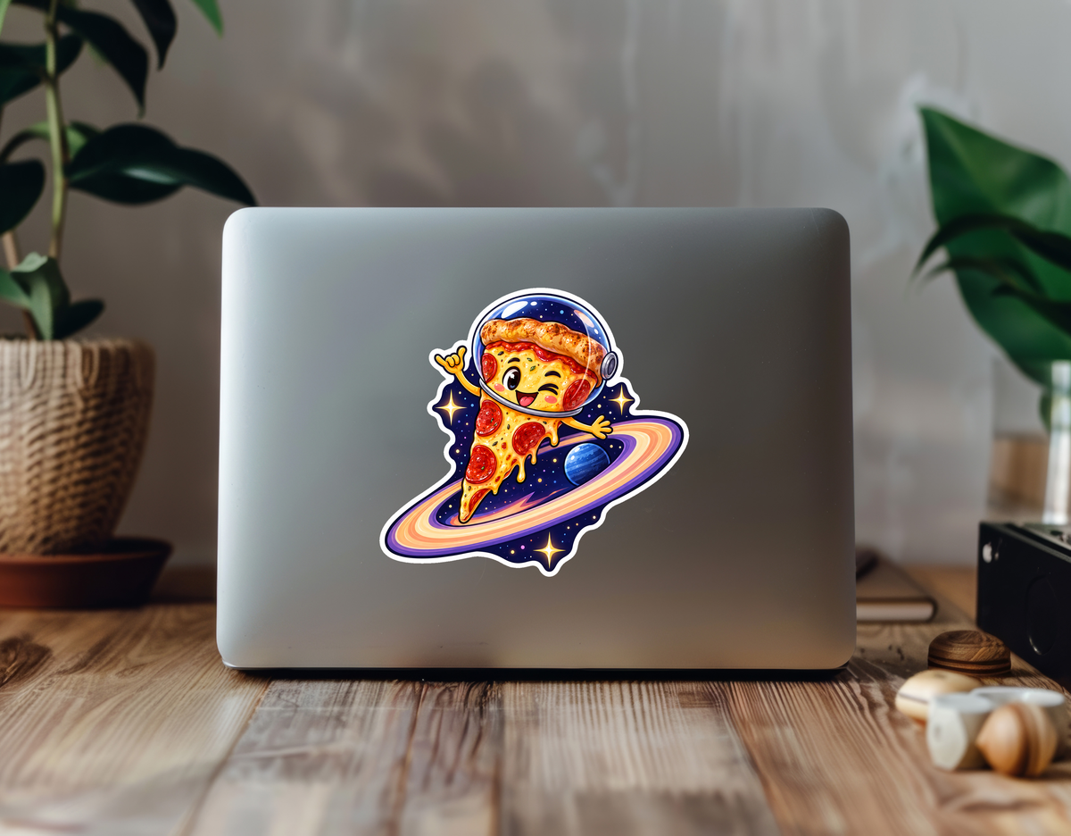 Cosmic Pizza Slice - Fun Food Vinyl Sticker sticker displayed on a laptop in a plant-filled workspace