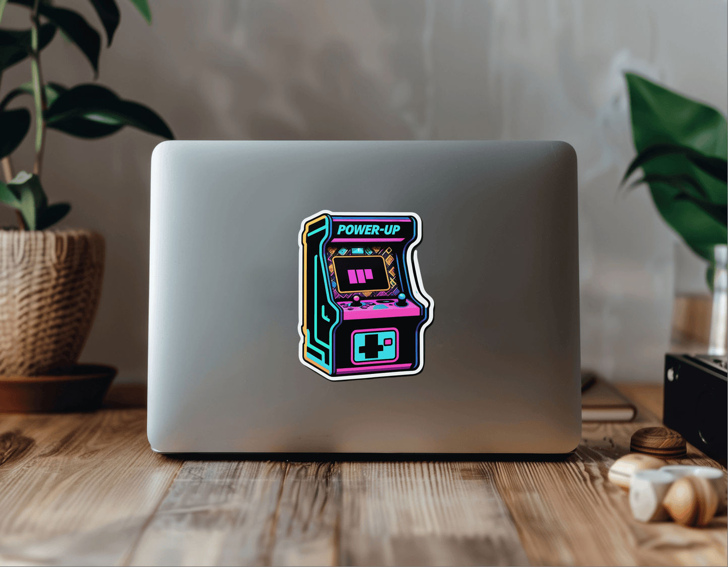 Retro Arcade Power vinyl sticker on a laptop featuring a colorful arcade machine design.
