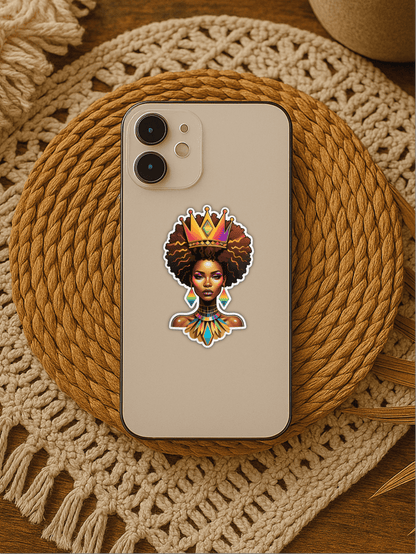 Rainbow Afrofuturist Queen Sticker on a phone case atop a woven mat.
