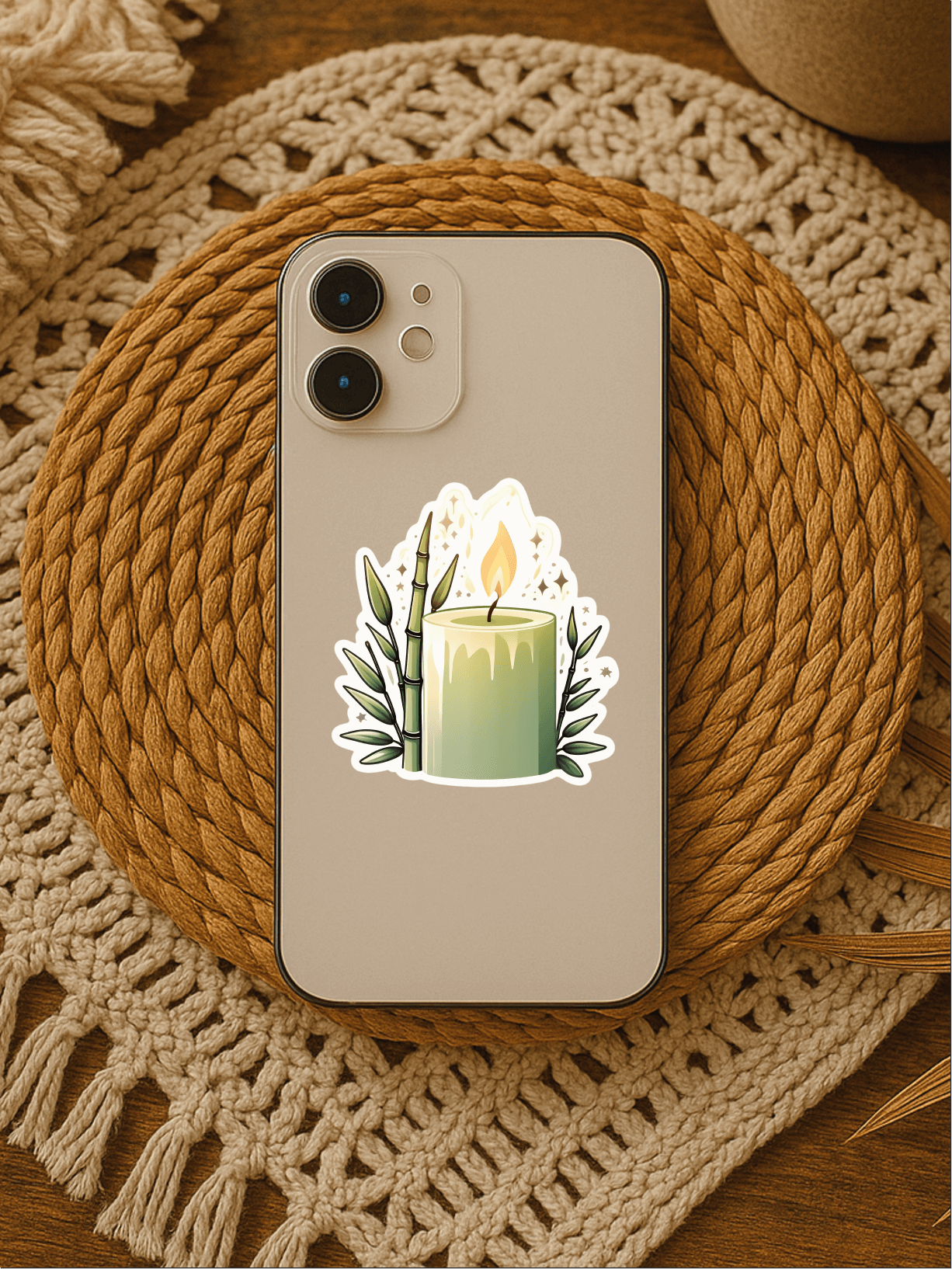 Calming Bamboo Candle Vinyl Sticker on a phone, showcasing a colorful candle design decorated with bamboo leaves.