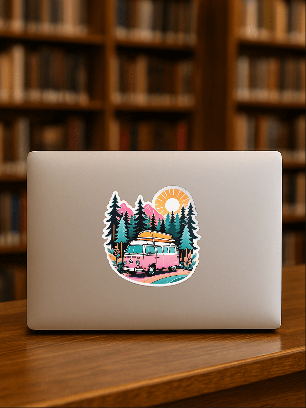 Chill Vanlife Sticker on a laptop with a colorful van and sunset design in a library setting.