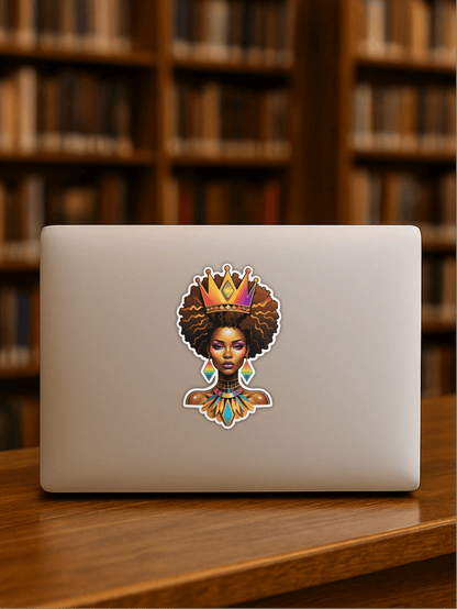 Rainbow Afrofuturist Queen Sticker on a laptop, showcasing vibrant design and artistry in a study setting.