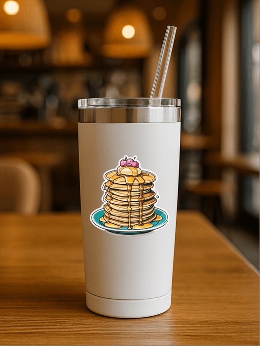Cherry on the top Pancake Stack Vinyl Sticker on a sleek tumbler in a cozy cafe setting