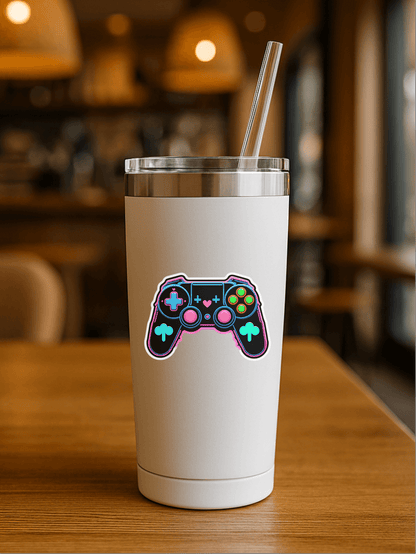 Level Up Neon Controller Vinyl Sticker on a stylish tumbler in a cozy café setting.