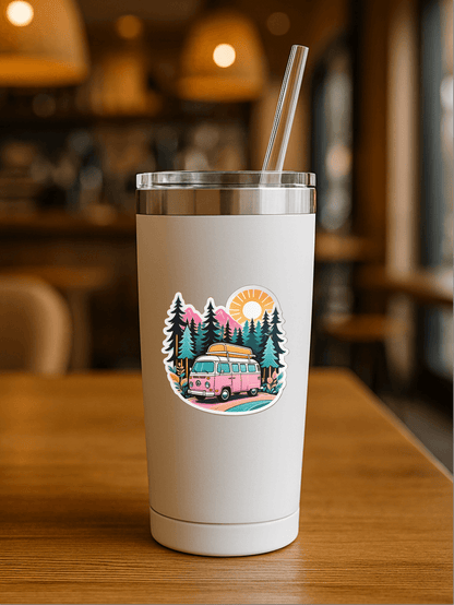 Chill Vanlife Sticker on a stylish tumbler with a vibrant van and nature design in a cozy café setting.